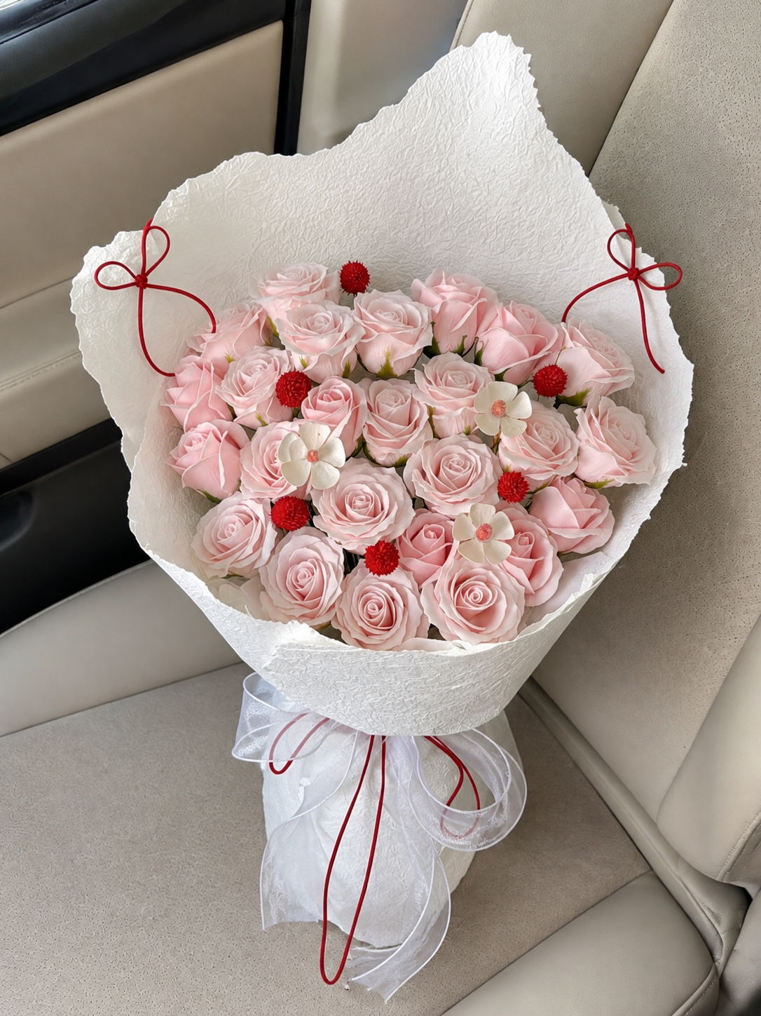 Champagne Blush Rose Luxe Bouquet, car-seat top view; AI design illustration