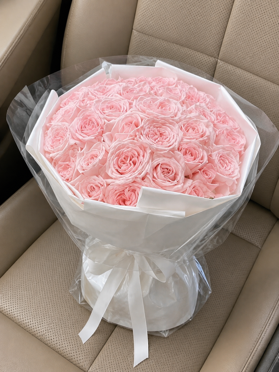 Pink Rose Ivory Classic Bouquet – high-angle bouquet on parked car seat