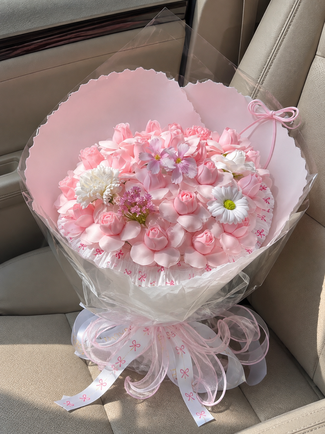 Pink Rose Spring Blossom Bouquet – high-angle bouquet on parked car seat