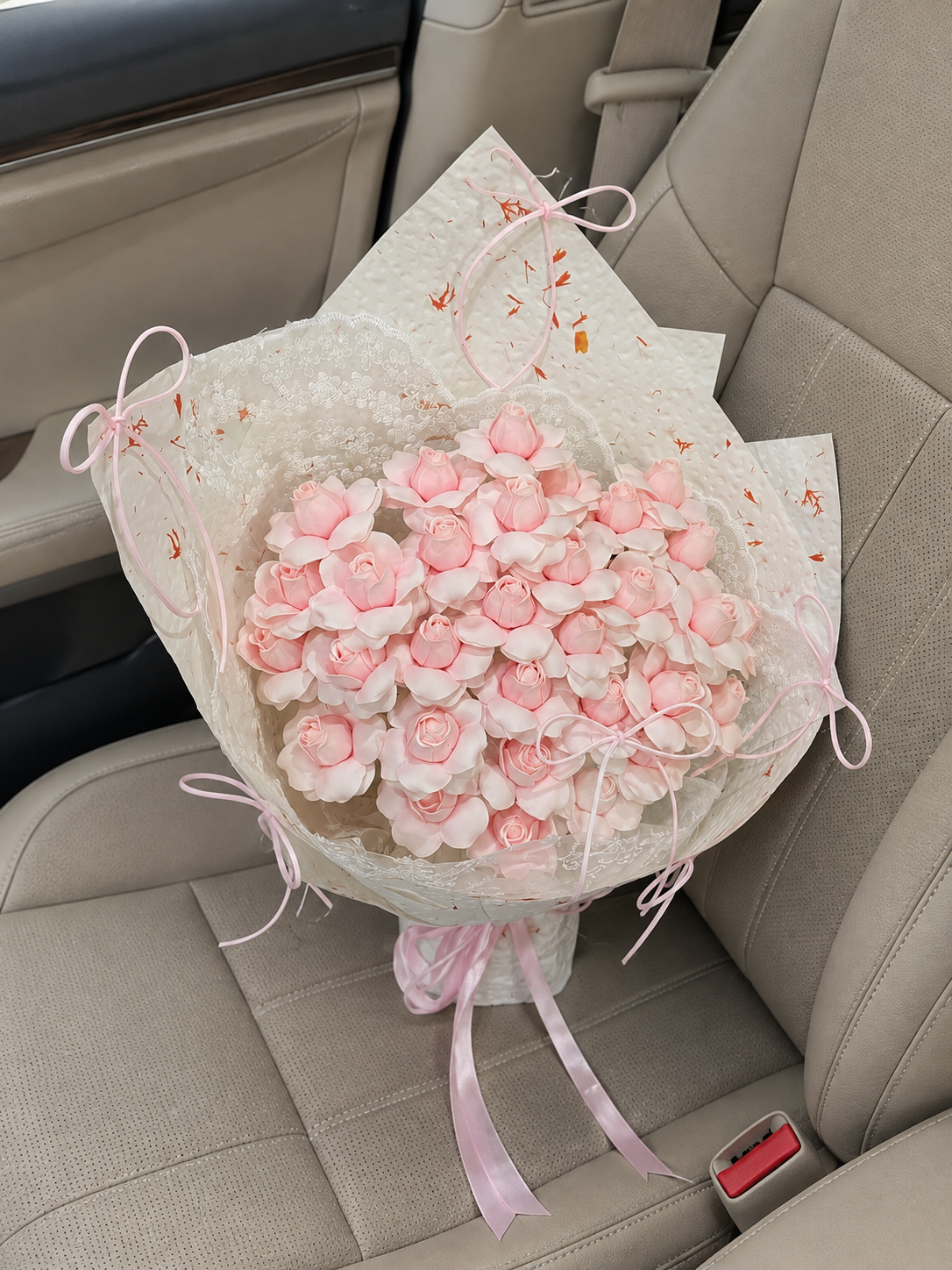 Pink Blossom Heart Lace Bouquet, high-angle car view; AI design illustration