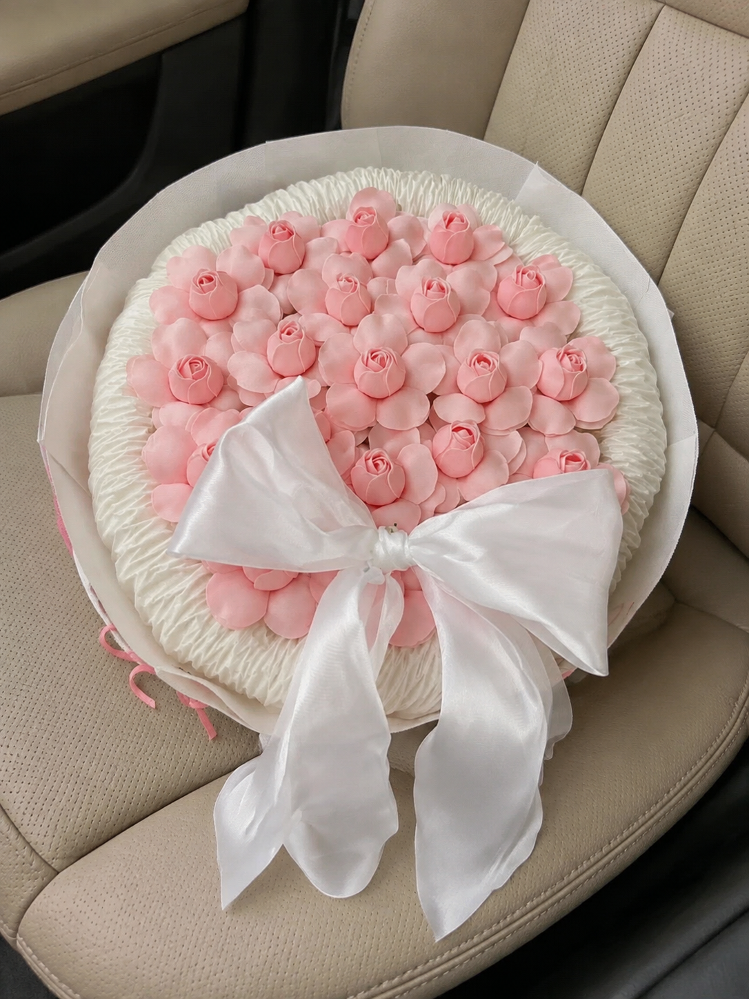 Pink Rosebud Ivory Bow Bouquet, high-angle car view; AI design illustration