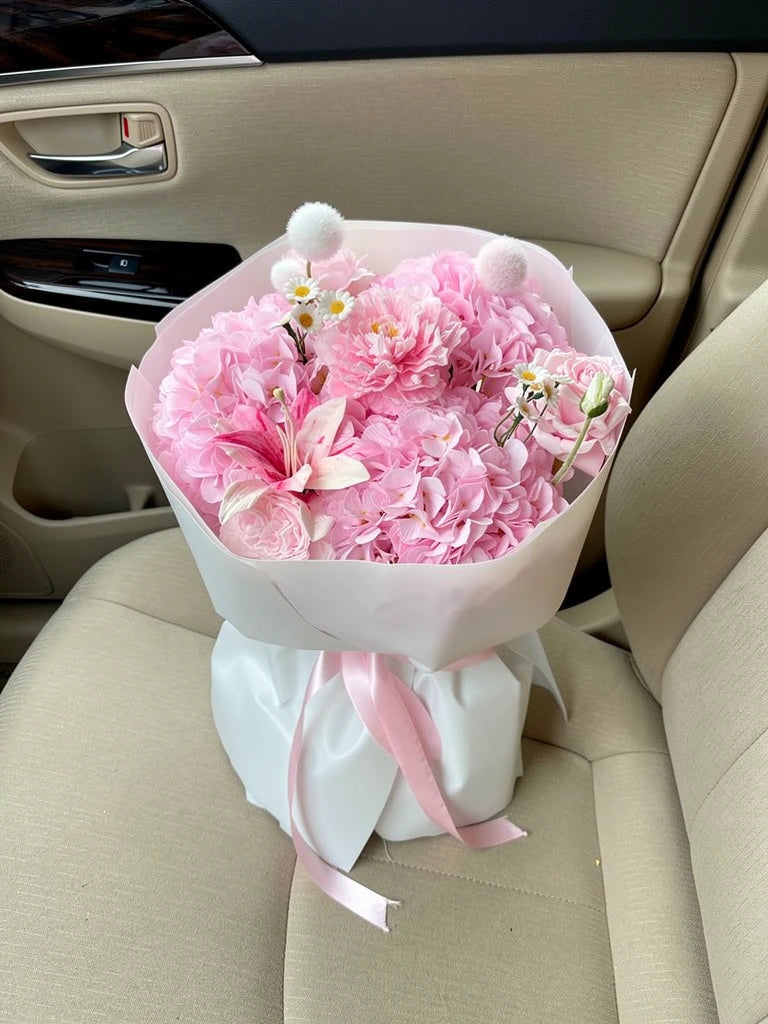 Blush Garden Hydrangea Bouquet, Medium, high-angle car-seat view; AI lifestyle illustration