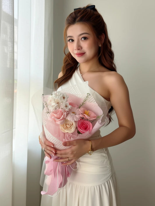Nguyen Lan holding Blush Meadow Small Flower Bouquet; AI lifestyle illustration