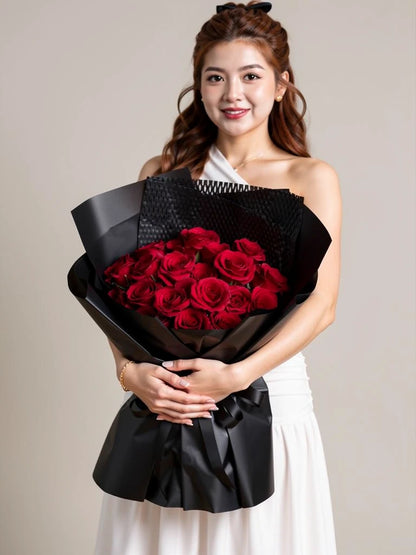Nguyen Lan holding Classic Red Rose Midnight Bouquet, Medium; AI lifestyle illustration