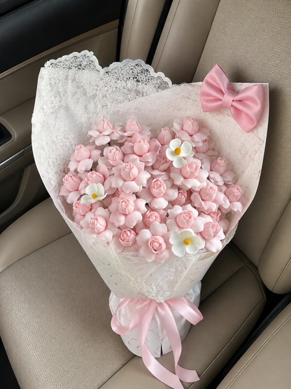 Birthday Pink Blossom Bow Bouquet – high-angle bouquet on parked car seat