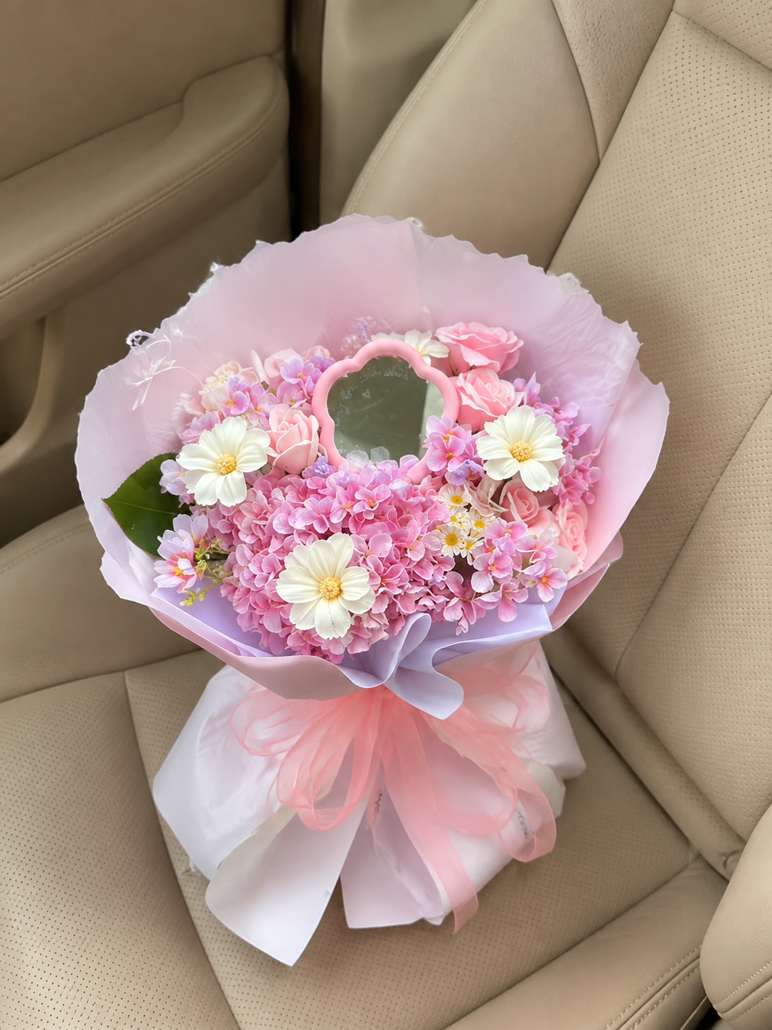 Pink Heart Message Garden Bouquet – high-angle bouquet on parked car seat