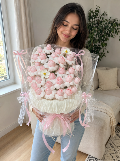 Pink Ivory Blossom Clear Wrap Bouquet – AI-assisted model holding bouquet at an angle
