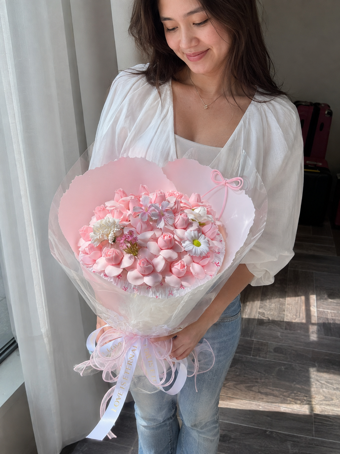 Pink Rose Spring Blossom Bouquet – AI-assisted model holding bouquet at an angle