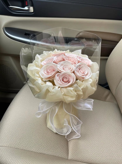 Ivory Champagne Rose Small Bouquet, Small, high-angle car-seat view; AI lifestyle illustration