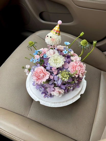 Lilac Cloud Party Flower Cake, Medium, high-angle car-seat view; AI lifestyle illustration