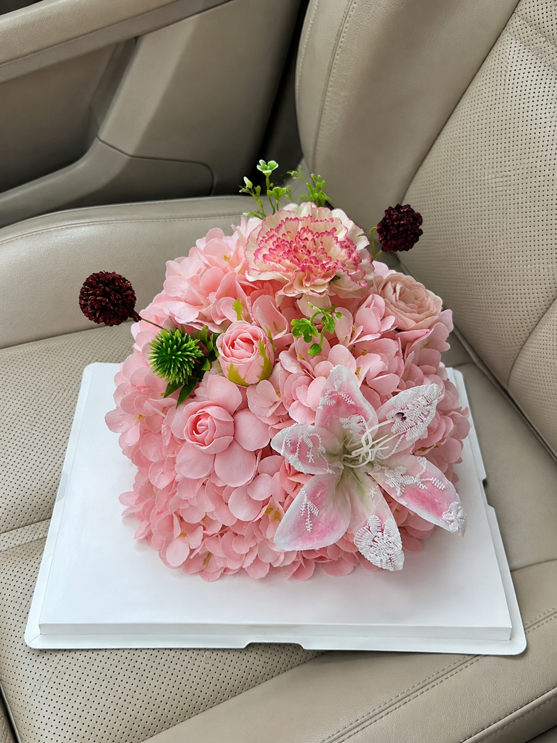 Peach Lily Celebration Flower Cake, high-angle car view; AI design illustration