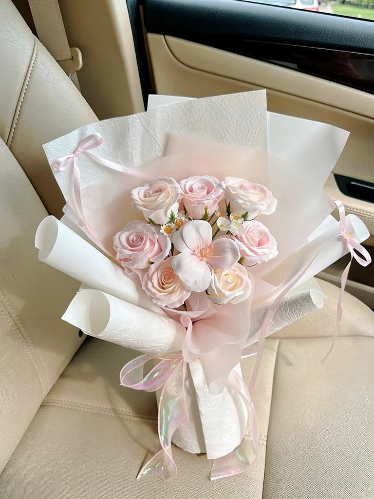 Petite Pink Rosebud Small Bouquet, Small, high-angle car-seat view; AI lifestyle illustration