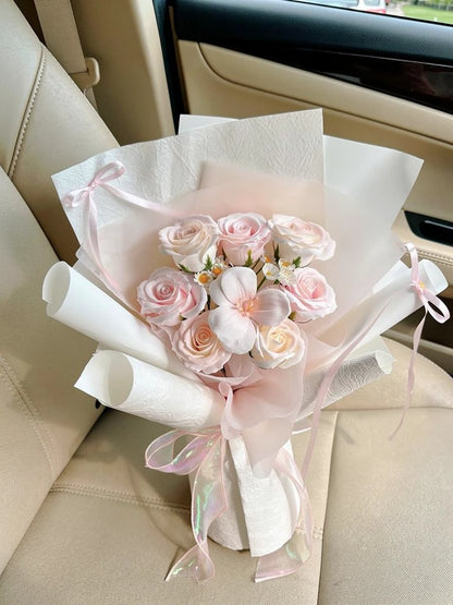 Petite Pink Rosebud Small Bouquet, Small, high-angle car-seat view; AI lifestyle illustration