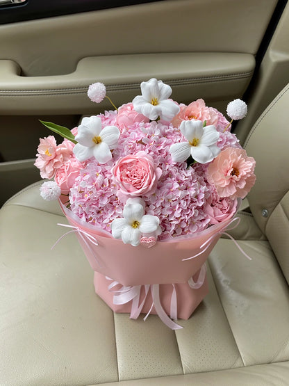 Pink Cloud Frangipani Bouquet, Medium, high-angle car-seat view; AI lifestyle illustration