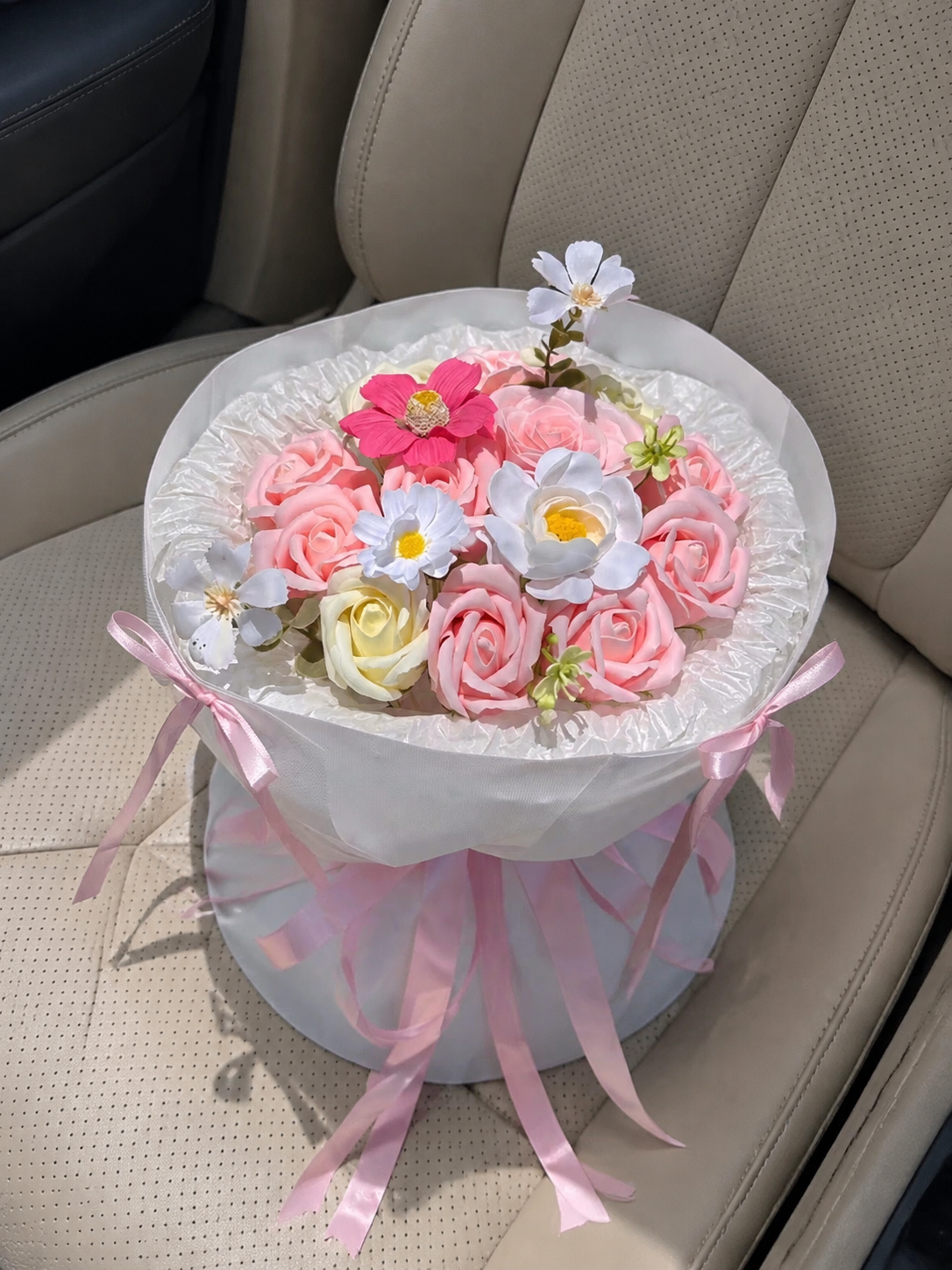 Pink Daisy Rose Petite Bouquet, high-angle car view; AI design illustration