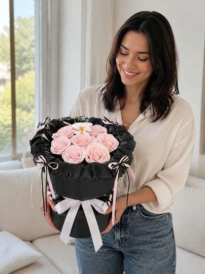 Pink Rose Black Ruffle Bouquet, person-held angled view; AI design illustration