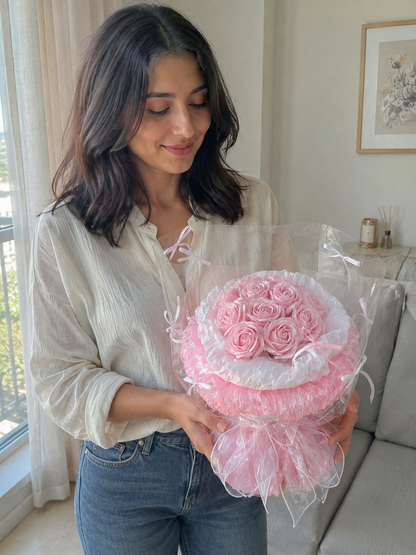 Pink Rose Tulle Posy, person-held angled view; AI design illustration