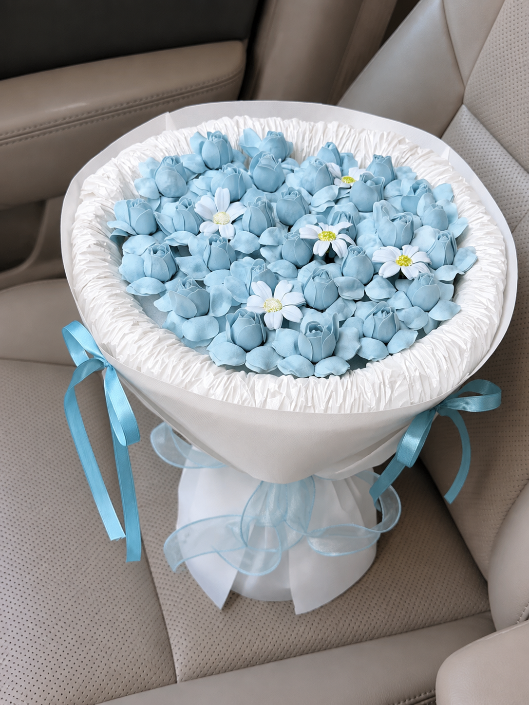 Powder Blue Tulip Daisy Bouquet, high-angle car view; AI design illustration