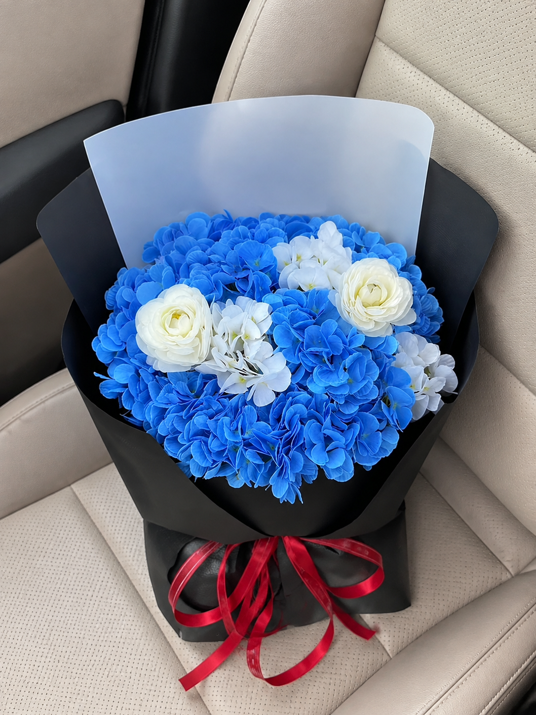 Royal Blue Ivory Rose Bouquet, car top view; AI design illustration