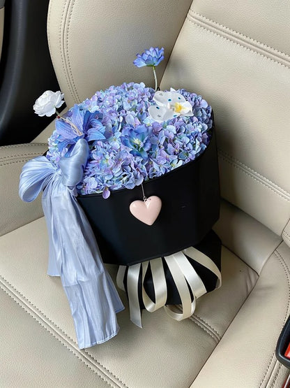 High-angle view of Twilight Blue Hydrangea Bouquet on a parked-car passenger seat; AI lifestyle illustration